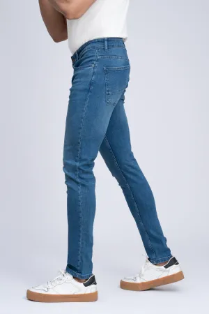 JEAN SLIM LEG LIGHT BLUE TINTED