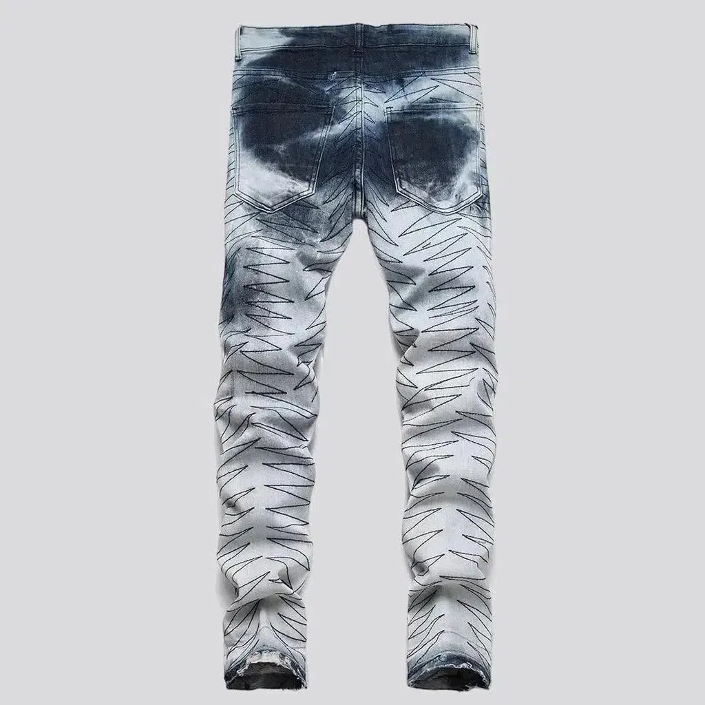 Raw-hem men's patched jeans