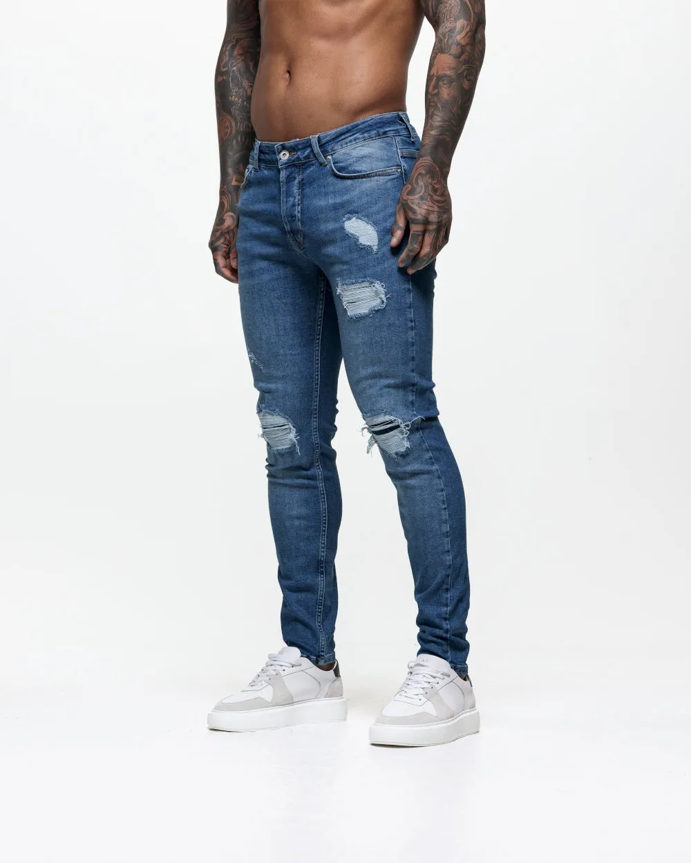 Ripped & Repaired Skinny Jeans - Blue Wash