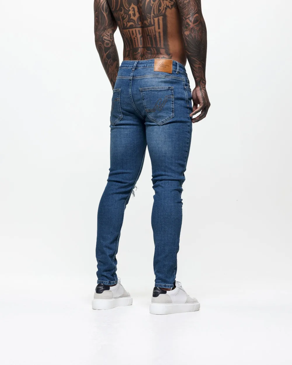 Ripped & Repaired Skinny Jeans - Blue Wash